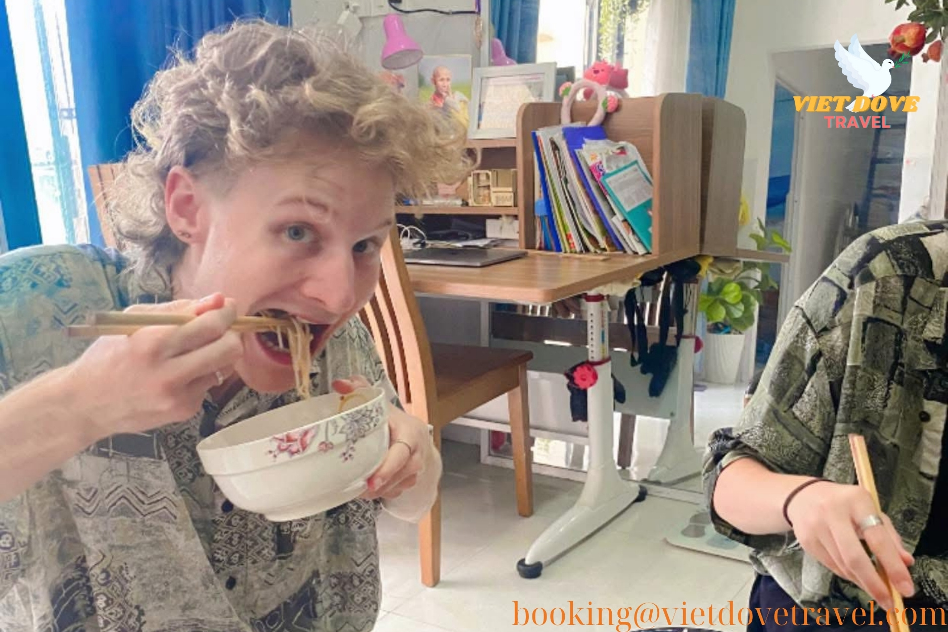 A traveler enjoying a bowl of chay noodles